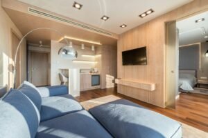 Bright and cozy living room with modern décor and an open kitchen layout.